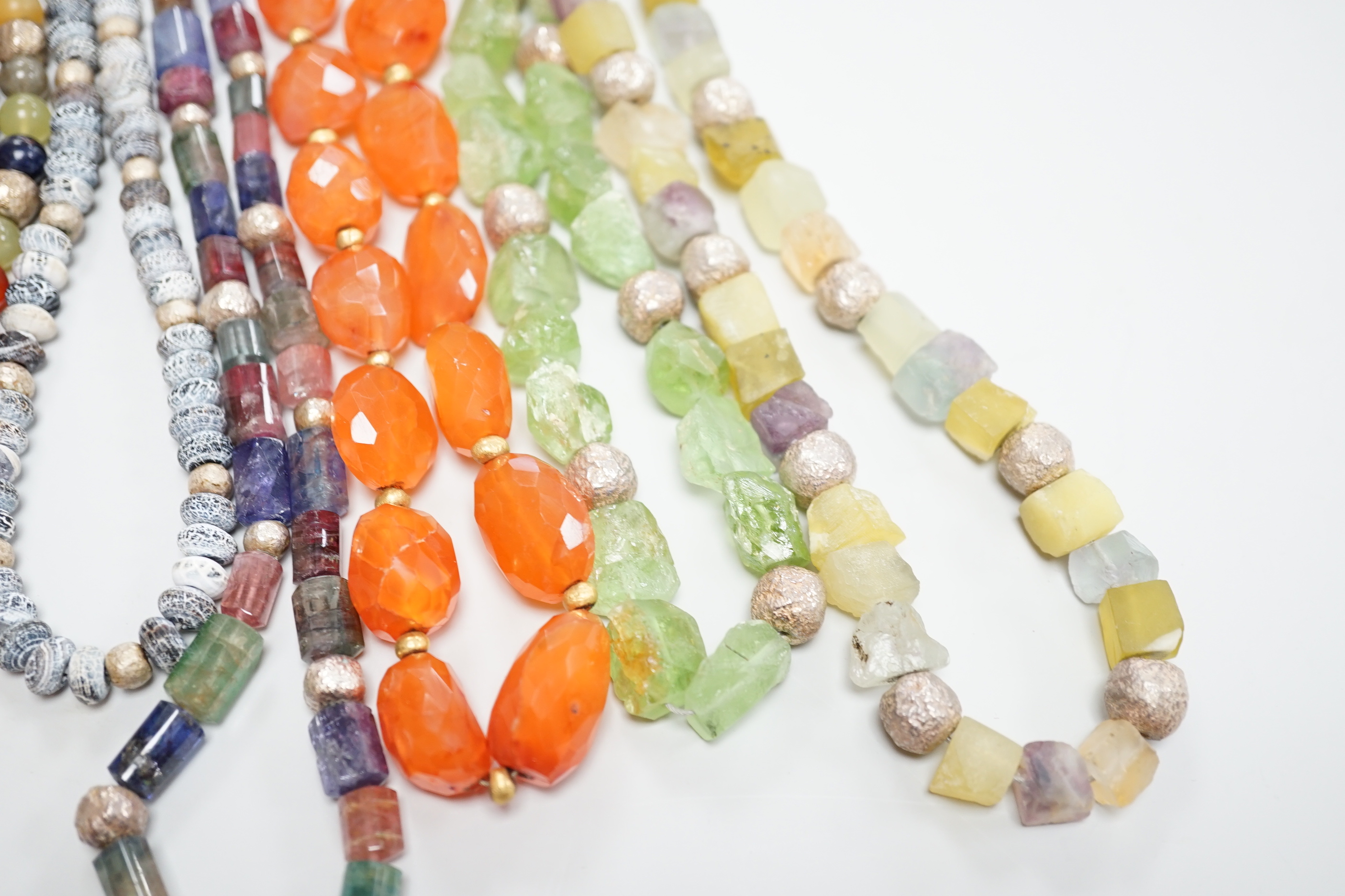 Five assorted Pruden & Smith silver and hardstone necklaces, largest 42cm and three other similar unsigned necklaces.
